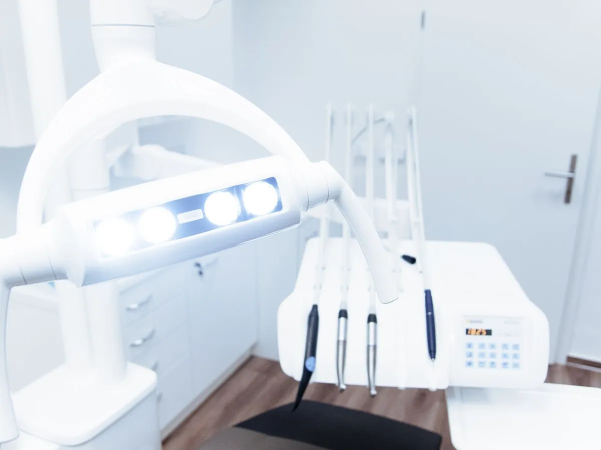 A modern dental treatment unit in a bright clinic room